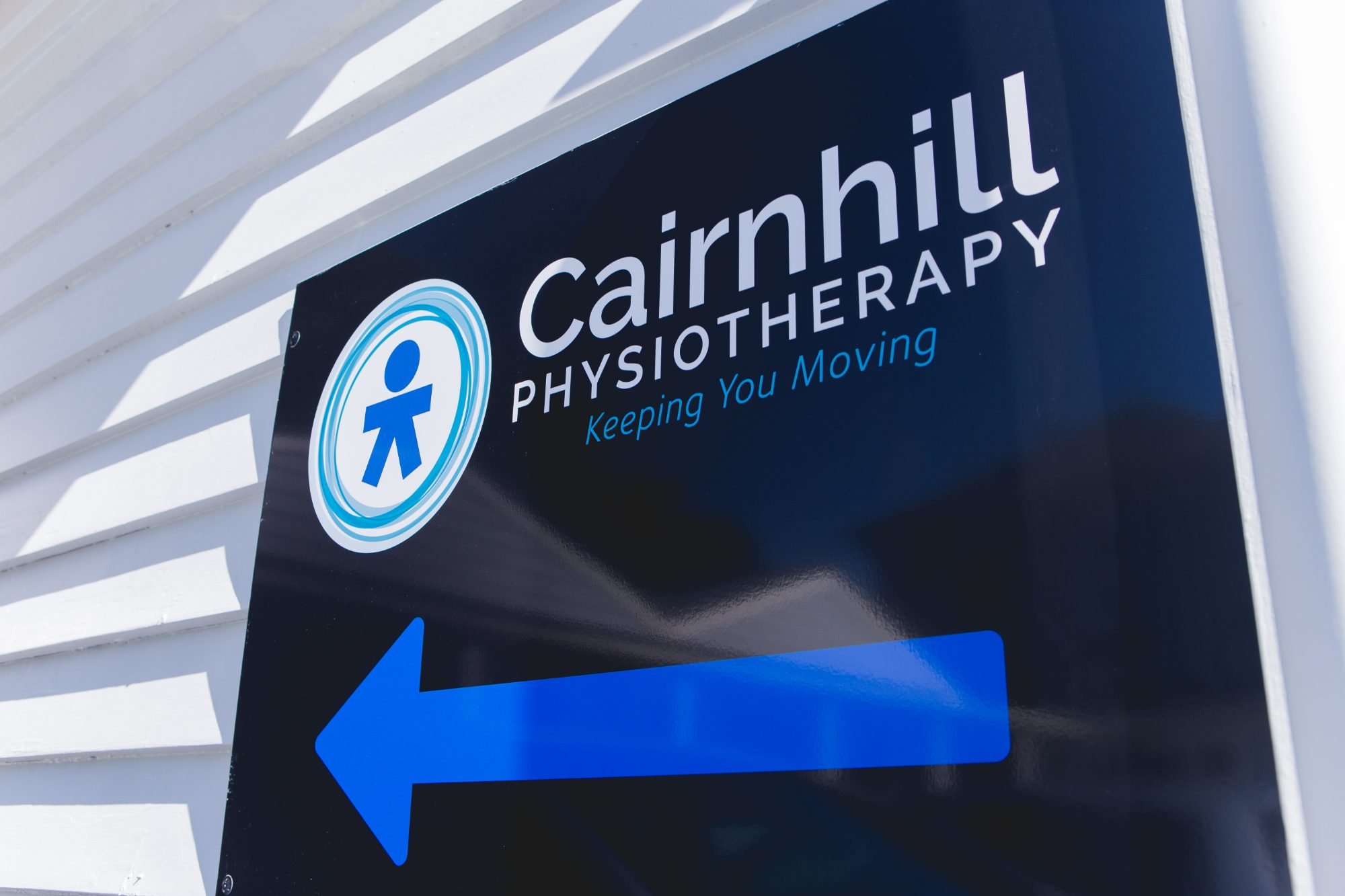 The Cairnhill Physiotherapy sign on the clinic’s weatherboard wall