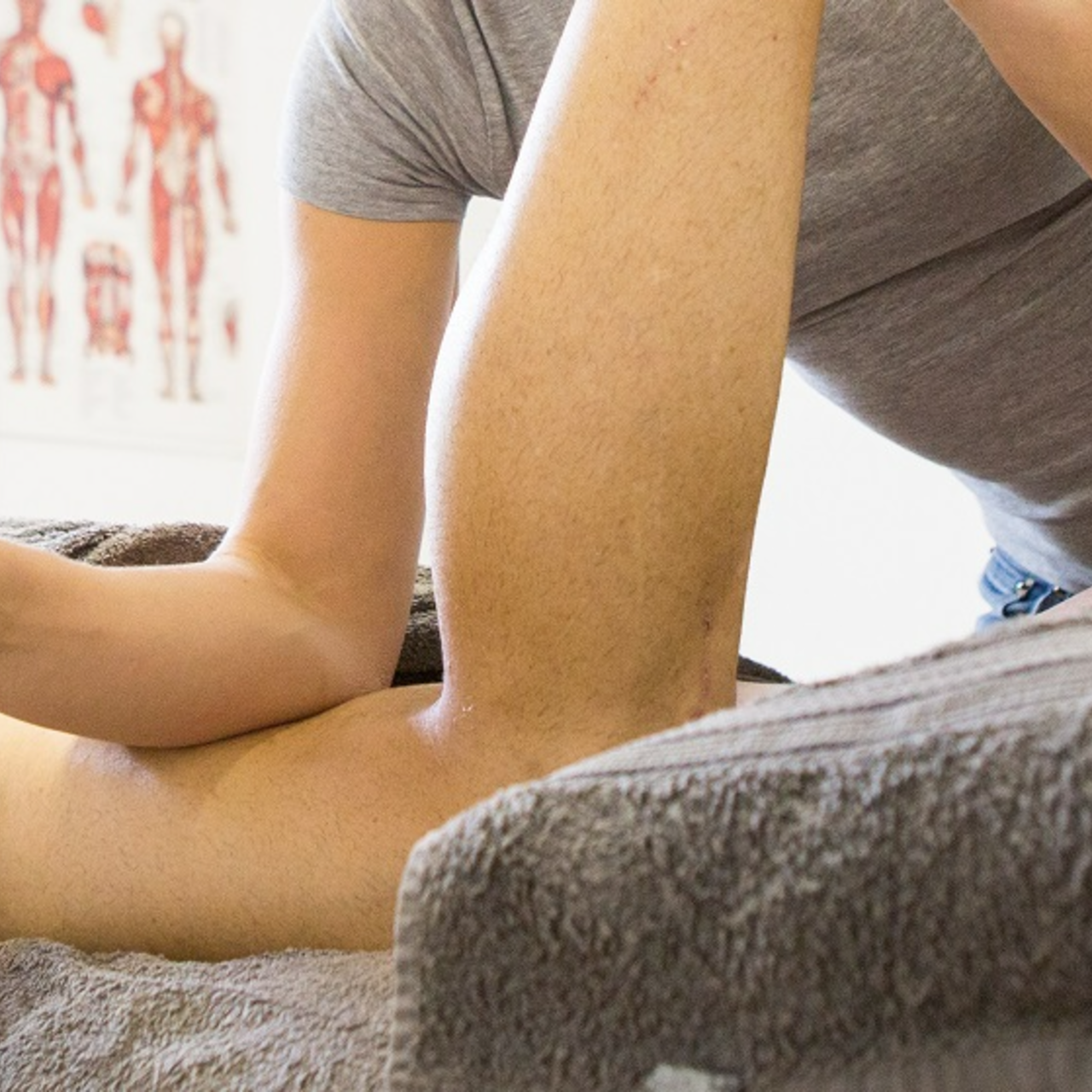 A massage therapist working on a client