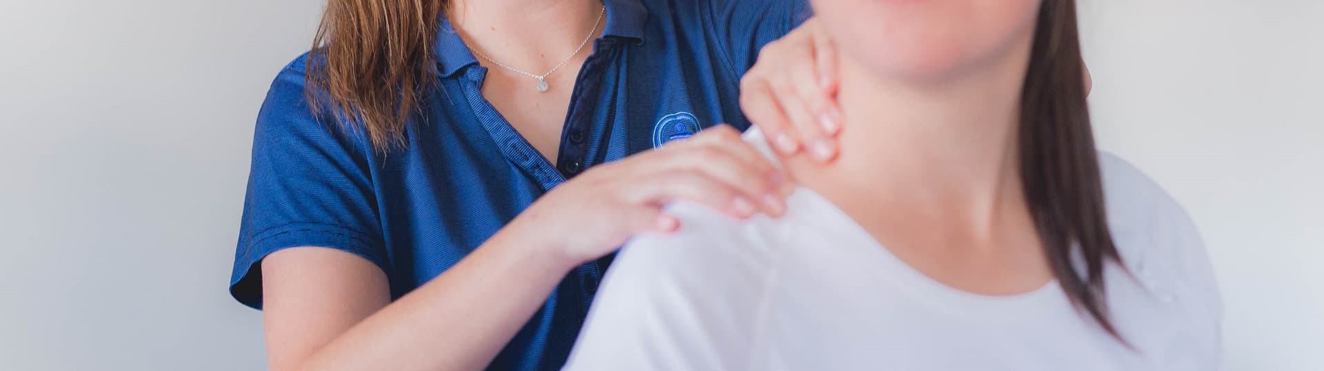 A therapist treating a client’s shoulder