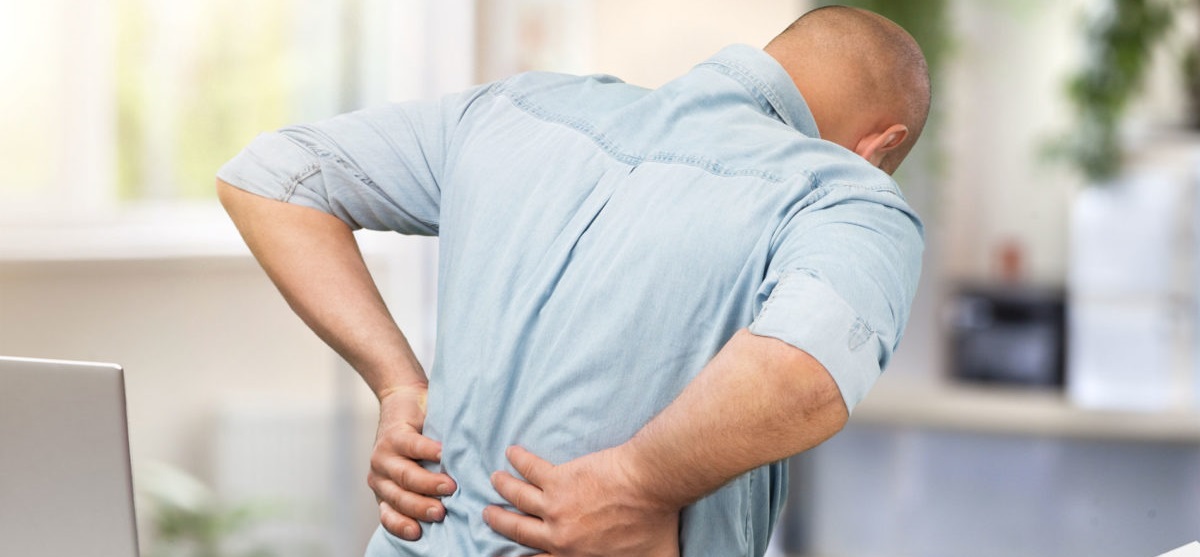 A physiotherapist treating a work-related back injury